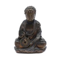 A bronze Chinese Buddha holding a coin, 9cm x 6cm x 5.5cm