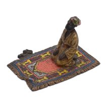 Bergman style cold painted bronze figure of a male figure performing Salah on a prayer mat. H 5cm...