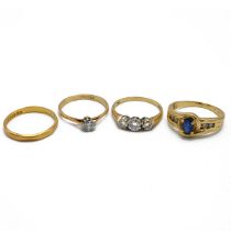 An 18ct gold three diamond ring, along with an 18ct gold dress ring, 18ct gold ring single stone ...
