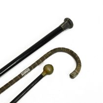 An ebonised swagger stick with spherical brass pommel bearing the Royal Marines insignia (70.5cm ...