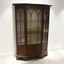 Early 20th Century mahogany china display cabinet of canted form with carved splaying pediment ov...