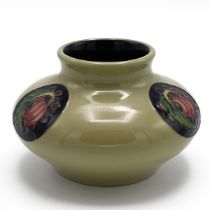 Moorcroft pottery trial piece, 2013. Celadon ground with three midnight blue discs containing tub...