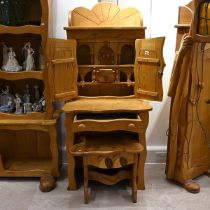 Late 20th century carved oak character desk with stool. The desk with cabinets over with carved w...