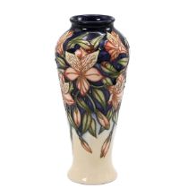 Moocroft "Peruvian Lily" slender baluster form vase by Sian Leeper, 2004. Size/Shape: 122/8. Heig...