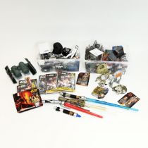 A collection of Stars Wars collectables to include various boxed toys, Lego collectors cards and ...
