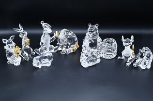 A collection of 16 Lennox Disney glass models of Winnie the Pooh, along with Bradford Exchange mo...
