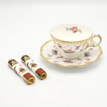 A Royal Crown Derby "Royal Antoinette" pattern cup and saucer and a pair of  Royal Crown Derby cu...
