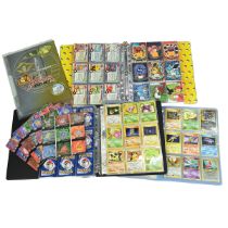 A collection of various Pokémon cards including Team rocket folder, holographic cars, Japanese Ne...