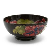 Moorcroft flambe Hibiscus bowl with unusual brown ground, signed WM to base with impressed Moorcr...