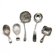 A George III silver tea caddy spoon hallmarked Birmingham 1814, Joseph Willmore, along with two G...