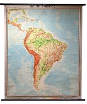 A mid century Westermann's Maps schoolroom map of South America. Canvas on ebonised wooden poles....