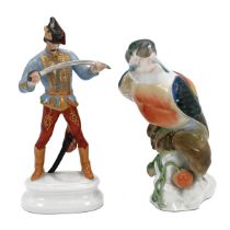 A Herend figurine of a Magyar with sword and a Herend figurine of a Kingfisher (losses to beak an...