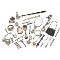 A collection of miscellaneous silver items to include miniature hand mirrors, letter opener, napk...