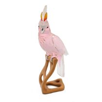 A Swarovski Paradise Birds Cockatoo figurine, Kakadu red crystal body with rhodium feet on a wood...