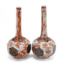 Pair of Meiji Period Japanese Imari Bottle Vases with octagonal faceted bowls and slender taperin...