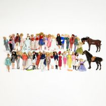 A large collection of modern collectors Barbie Dolls, accessories and boxes, mostly on metal disp...