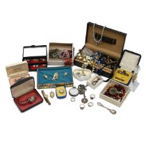 A collection of costume jewellery including pendants, rings, necklaces and other items.