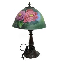 Two 20th century Tiffany style lamps, one with a metal base modelled as a tree trunk with a marbe...