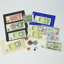 Group of banknotes, coin holders, Roman coins and tokens. Includes coin holders (x2), Roman coin ...