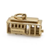 Tiffany & Co - An 18ct yellow gold charm, modelled as a tram, set with a single round brilliant c...