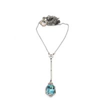 An Art Deco 18ct white gold and platinum pendant necklace, set with an octagonal mixed cut blue z...