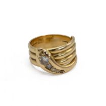 An 18ct gold Victorian snake ring, set with five graduated old cut diamonds, weighting approximat...