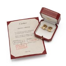 Cartier - A pair of 18ct yellow gold clip on earrings, designed as interlocking Cs, signed Cartie...