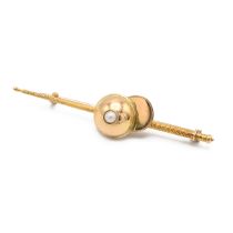 Horseracing Interest - An early 20th century 18ct yellow gold novelty bar brooch, modelled as a j...