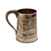 A George III silver tankard, with reeded semi decoration and a scroll handle, London 1797, John E...