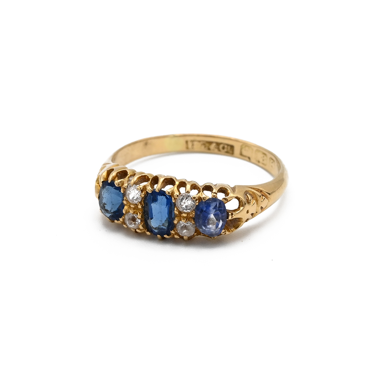 A Victorian 18ct yellow gold sapphire and diamond ring, set with three oval mixed cut sapphires a...