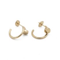 Cartier - A pair of 18ct gold 'Just un Clou' half hoop earrings, numbered 'IMY896', total gross w...