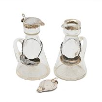 A pair of George silver whisky noggins, Birmingham 1920, with matching silver labels. 11cm high. (S)