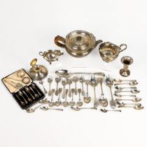 A collection of miscellaneous silver items to include a three piece silver tea set, various cutle...
