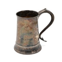 A George III silver tankard, of plain tapering form with a curved shaped handle and heart shaped ...