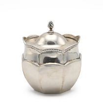 An Edwardian silver tea caddy, of oval form with a hinged top and flame finial, Birmingham 1903, ...