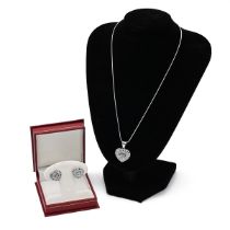 An 18ct white gold, sapphire, diamond heart shaped pave set necklace and chain, on silver chain, ...