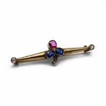 A Russian sapphire, ruby, and diamond bar brooch, the stone set clover motif with old cut diamond...
