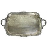 A Victorian silver two-handled tray with a shell and gadroon border, inscribed "Presented to H.A....