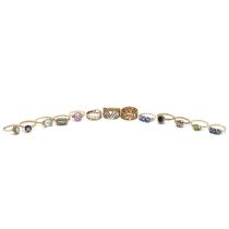 A collection of ten 9ct gold gem set rings, various sizes and makers, 30.47 grams. (J)