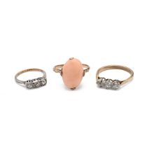 A gold and diamond three stone ring, finger size p, along with a three stone ring and one other g...