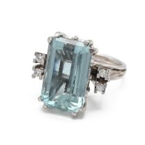 A 15ct white gold aquamarine and diamond cocktail ring, the step cut aquamarine approximately 17m...