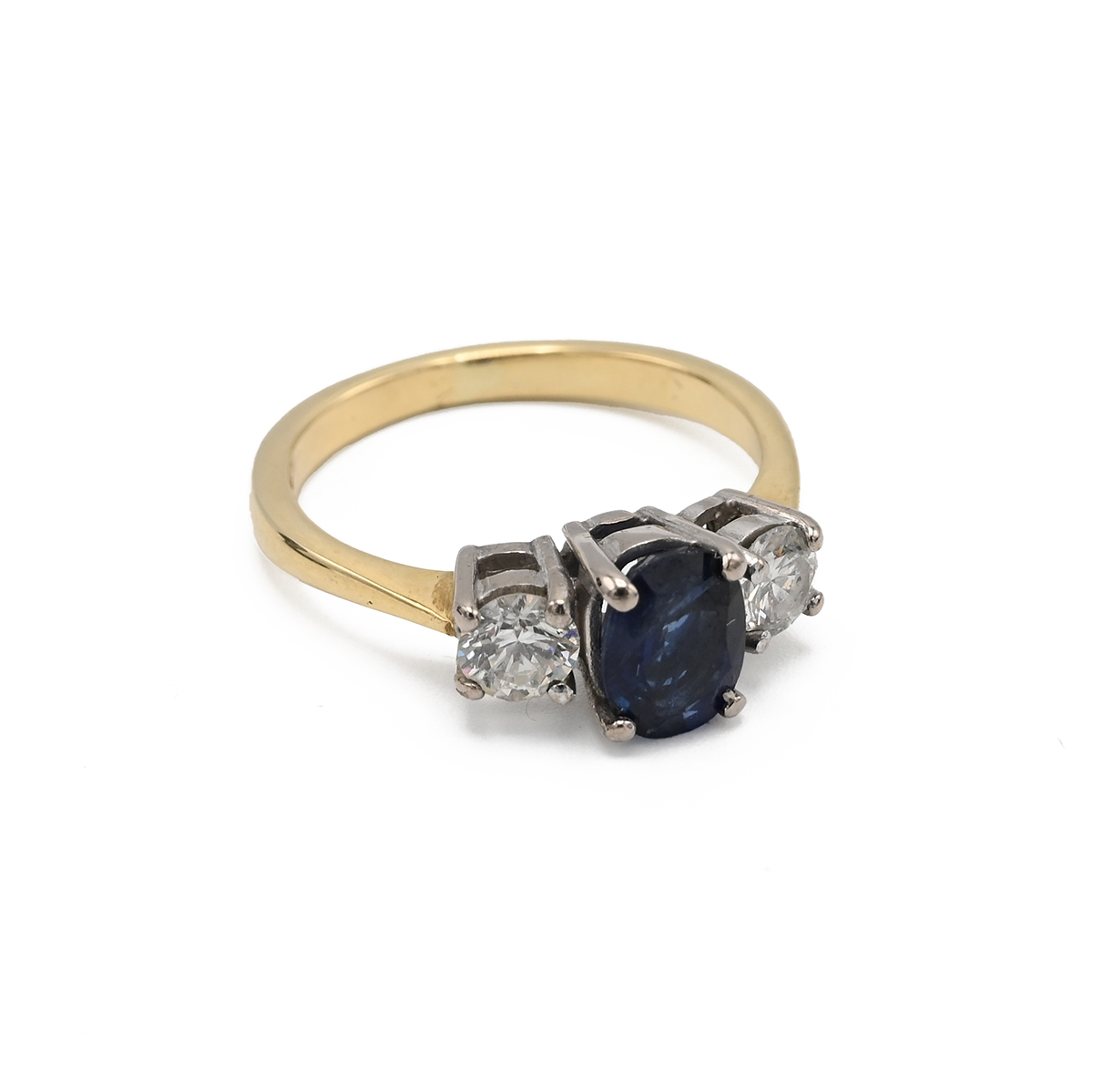 An 18ct yellow gold sapphire and diamond three stone ring, the oval cut sapphire flanked by two r... - Image 2 of 5