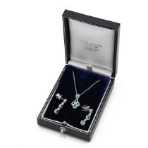 An 18ct white gold emerald and diamond pendant and earring set, the pendant set with five round c...