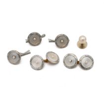 A mother of pearl stud set, to include a pair of cufflinks, three buttons and single stud, the ye...