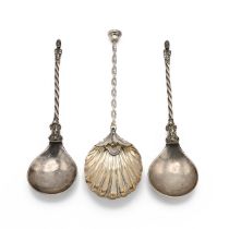 A pair of two silver spoons featuring a boy at the neck, twist stem handle and a bust as the term...