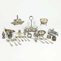 A Victorian silver oil and vinegar set, along with various other silver items to include toast ra...