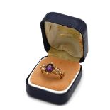 An 18ct yellow gold amethyst and seed pearl ring, ring size M, total gross weight approximately 3...