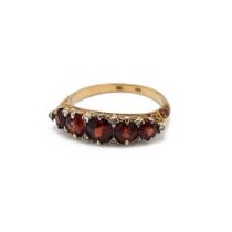 A Victorian 18ct yellow gold garnet seven stone ring, with rose cut diamond accents, ring size O1...