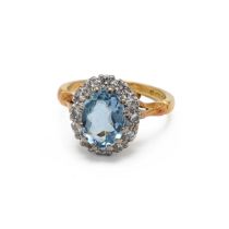 An 18ct yellow gold aquamarine and diamond oval cluster ring, ring size I1/2, total gross weight ...