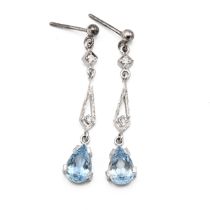 A pair of 18ct white gold aquamarine and diamond pendant drop earrings, each earring set with a p...